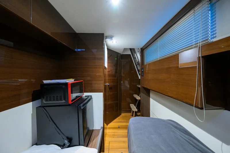 Slide: The Image of Interior of 2020 Princess F70 yacht with modern wood finish and compact appliances. - 72