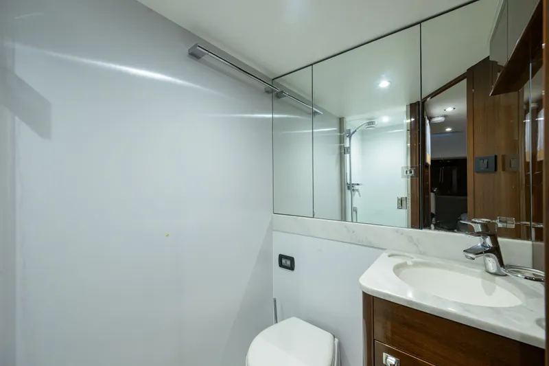 Slide: The Image of Luxurious bathroom in 2020 Princess F70 yacht with modern fixtures and mirrored cabinets. - 73