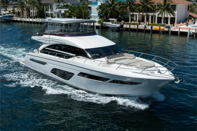 Slide: The Image of Luxurious 2020 Princess F70 yacht cruising on a scenic waterfront. - 8