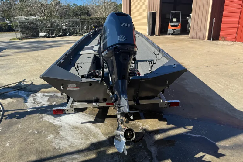 Slide: The Image of 2018 Alumacraft Crappie Deluxe boat with Yamaha 70 engine on trailer. - 5