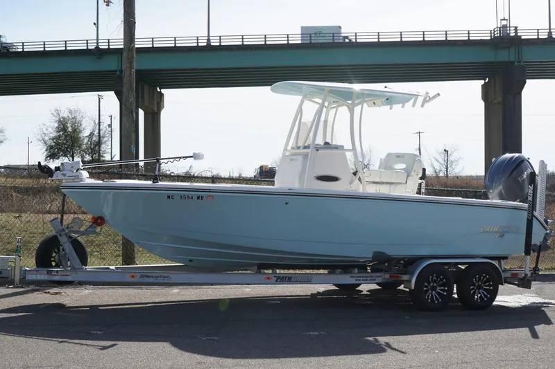 Slide: The Image of 2023 Pathfinder 2400 TRS boat on trailer under bridge, side view. - 4