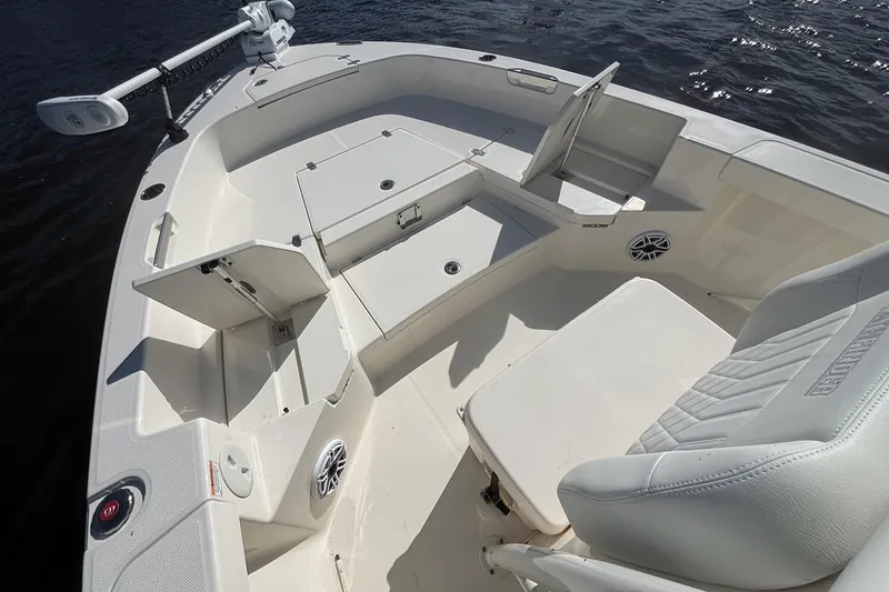 Slide: The Image of 2023 Pathfinder 2400 TRS boat interior with seating and storage compartments. - 5