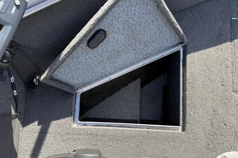 Slide: The Image of Open storage compartment in 2014 Lund 1875 Impact SS boat, carpeted interior. - 10