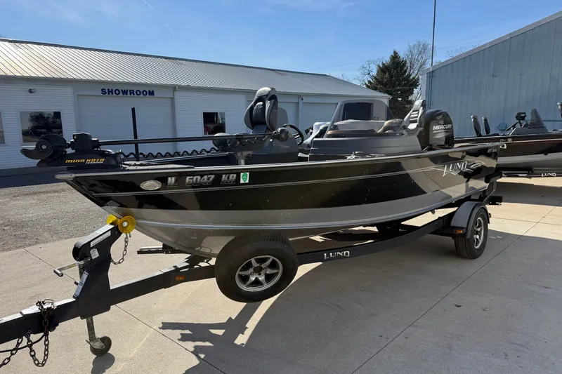 Slide: The Image of 2014 Lund 1875 Impact SS fishing boat on trailer outside showroom. - 3