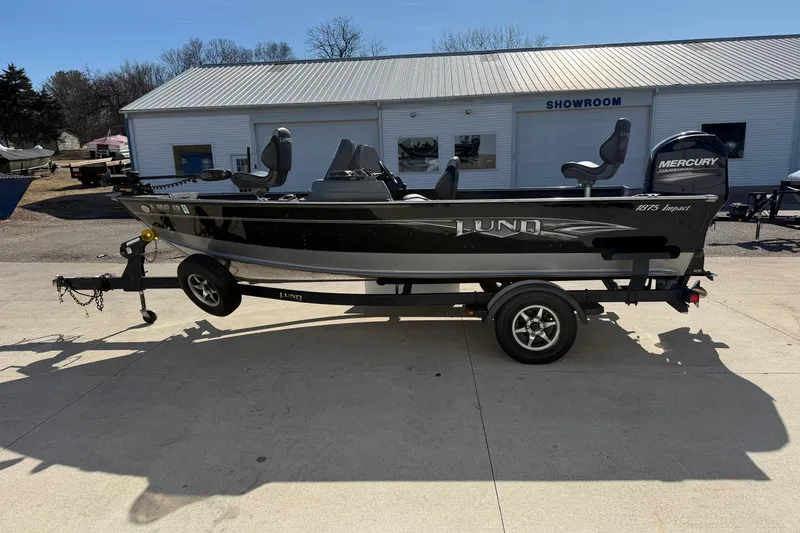 Slide: The Image of 2014 Lund 1875 Impact SS fishing boat on trailer outside showroom. - 4