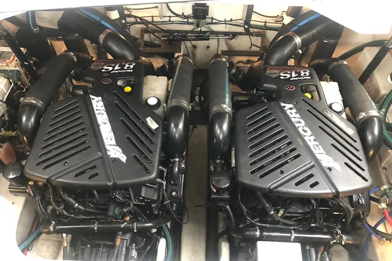 Slide: The Image of Twin Mercury engines in a 2008 Sea Ray 340 Sundancer boat engine compartment. - 13
