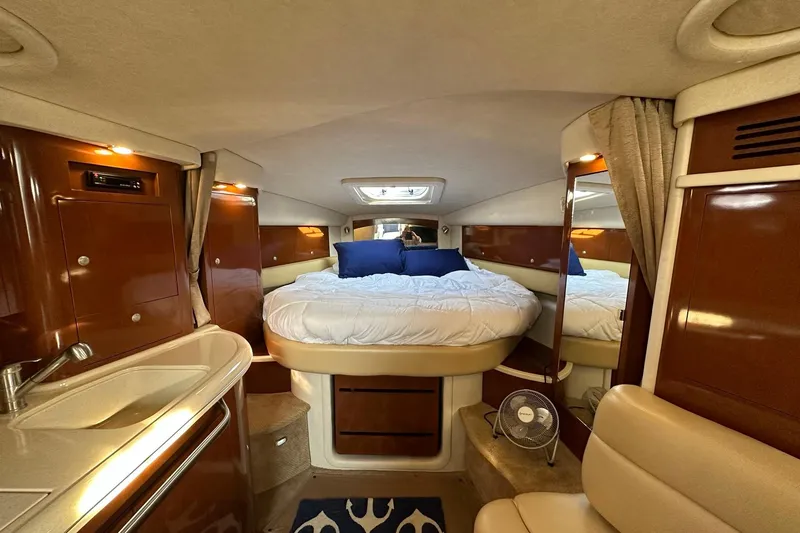Slide: The Image of Luxurious interior of 2008 Sea Ray 340 Sundancer yacht with cozy bed and elegant wood finish. - 14