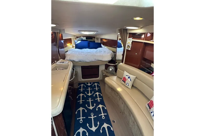 Slide: The Image of Luxurious interior of 2008 Sea Ray 340 Sundancer with cozy bed and nautical decor. - 15
