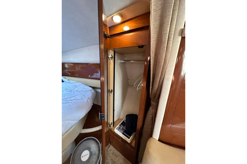 Slide: The Image of Interior of 2008 Sea Ray 340 Sundancer with closet and bed. - 19