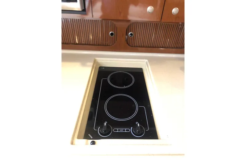 Slide: The Image of 2008 Sea Ray 340 Sundancer kitchen with sleek electric stovetop. - 21