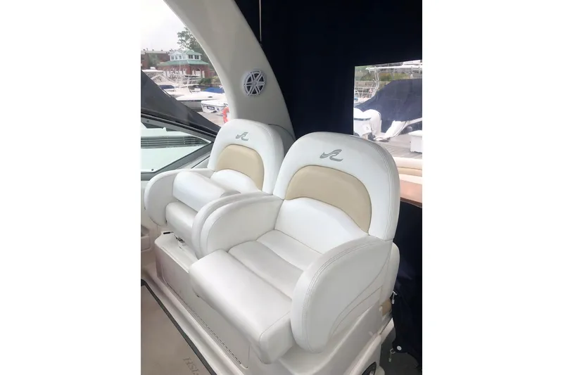 Slide: The Image of Luxury seating on 2008 Sea Ray 340 Sundancer yacht, featuring plush white upholstery. - 9