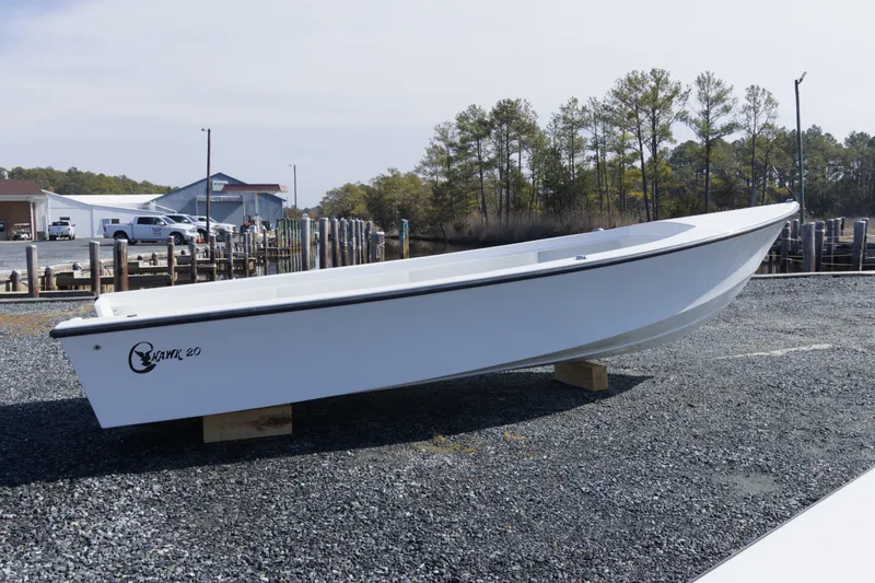 The Image of 2026 C-Hawk 20 Commercial boat on gravel near docks and trees. - 0