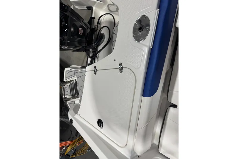 Slide: The Image of 2024 Tahoe 185 S boat interior detail with white and blue accents. - 100
