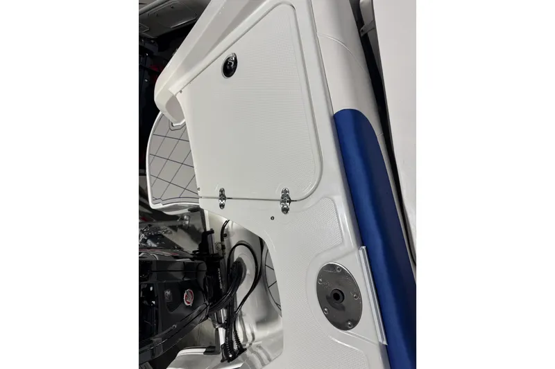 Slide: The Image of 2024 Tahoe 185 S boat interior detail with storage compartment and blue accent. - 101