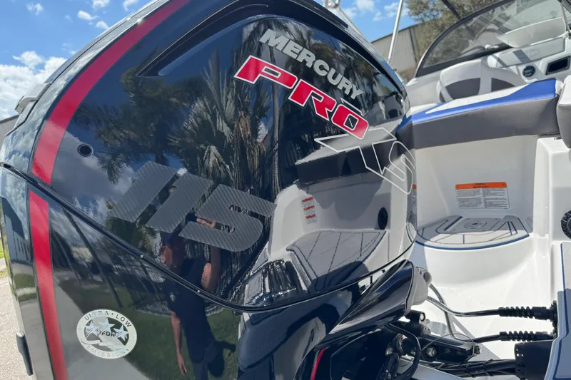 Slide: The Image of 2024 Tahoe 185 S boat with Mercury Pro 115 engine, outdoor setting. - 11