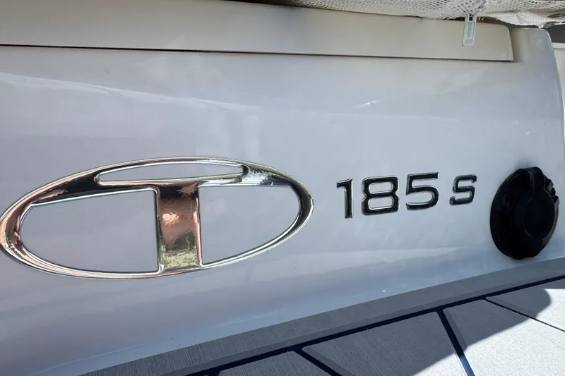 Slide: The Image of 2024 Tahoe 185 S boat emblem on white surface. - 26