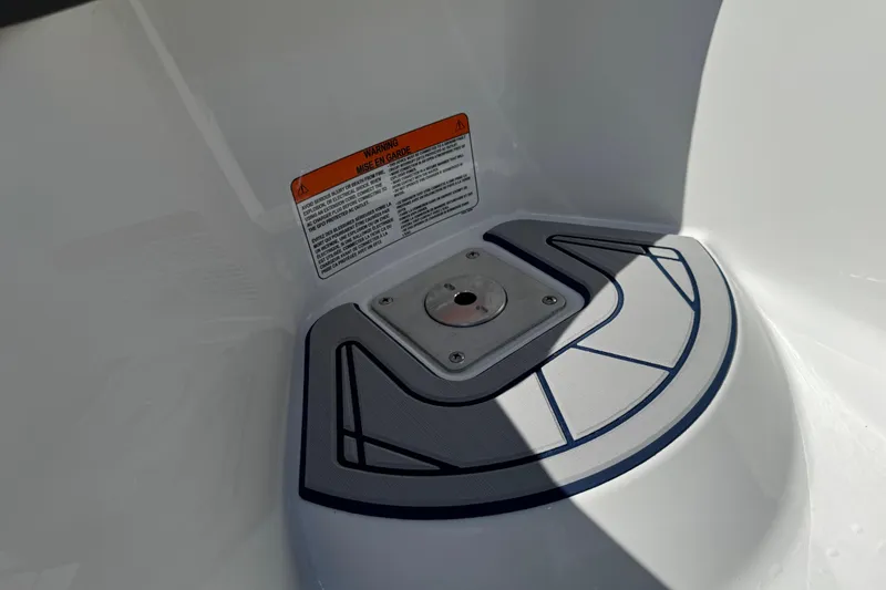 Slide: The Image of 2024 Tahoe 185 S boat deck with warning label and mounting plate. - 27