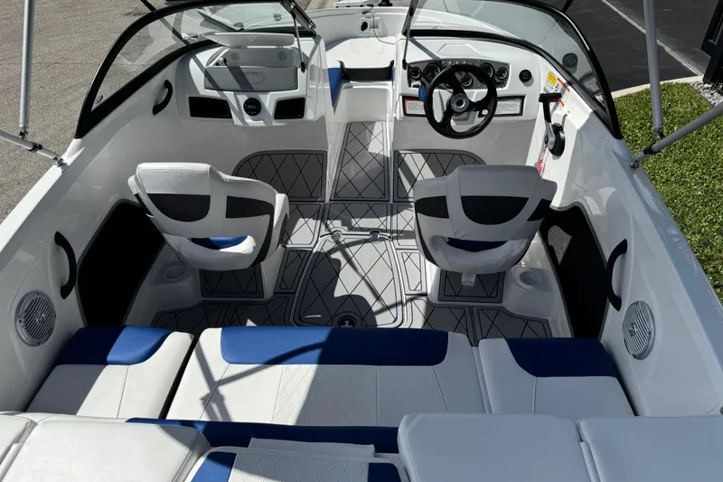 Slide: The Image of 2024 Tahoe 185 S boat interior with modern seating and steering wheel. - 32