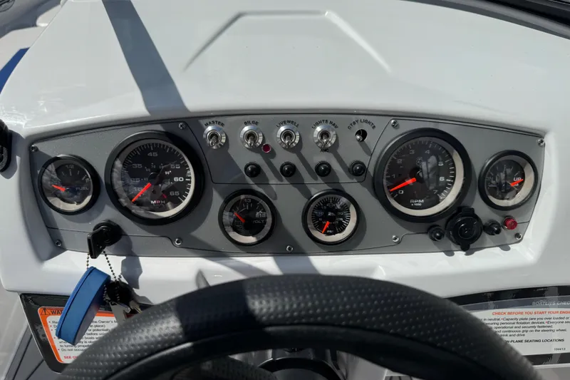 Slide: The Image of Dashboard of 2024 Tahoe 185 S boat with gauges and controls. - 43