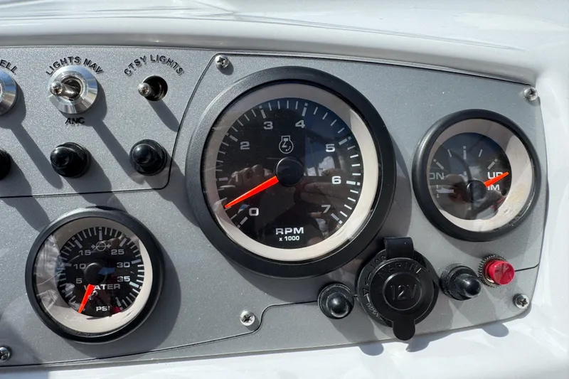 Slide: The Image of Dashboard of 2024 Tahoe 185 S boat with RPM and PSI gauges. - 44
