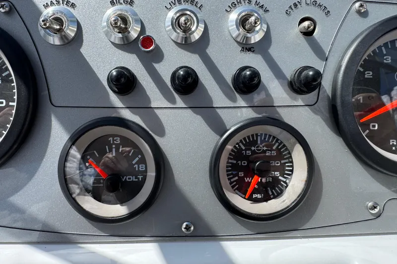 Slide: The Image of Dashboard of 2024 Tahoe 185 S boat with gauges and switches. - 46