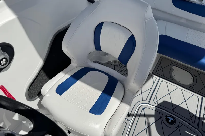 Slide: The Image of 2024 Tahoe 185 S boat interior with white and blue seating. - 51