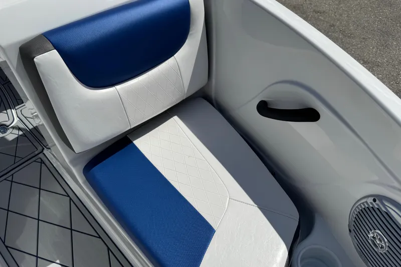 Slide: The Image of 2024 Tahoe 185 S boat seat with blue and white upholstery, featuring a speaker and cup holder. - 60