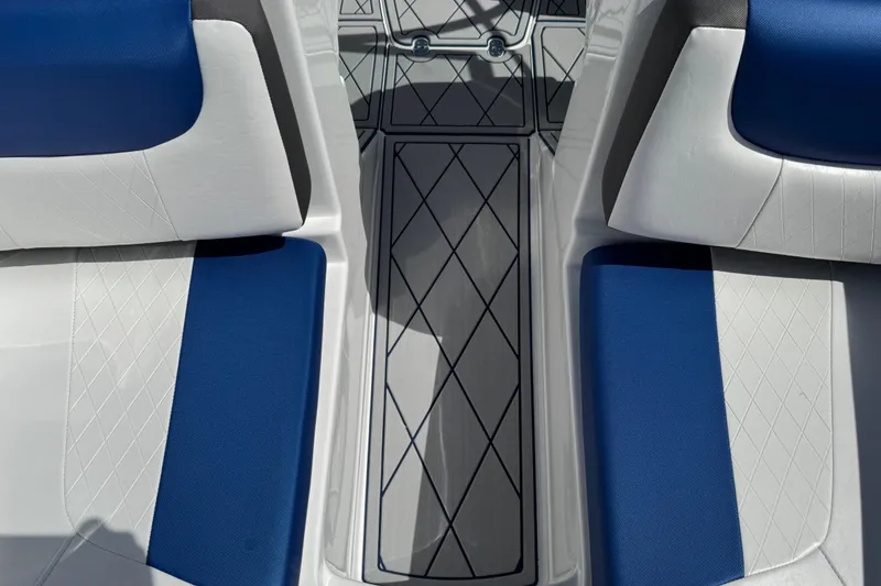 Slide: The Image of 2024 Tahoe 185 S boat interior with blue and white seating, diamond-patterned flooring. - 62