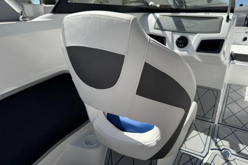Slide: The Image of 2024 Tahoe 185 S boat interior with modern seating and dashboard design. - 77