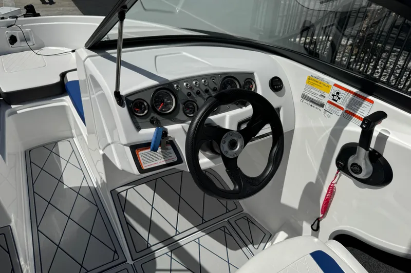Slide: The Image of 2024 Tahoe 185 S boat cockpit with steering wheel and control panel. - 78