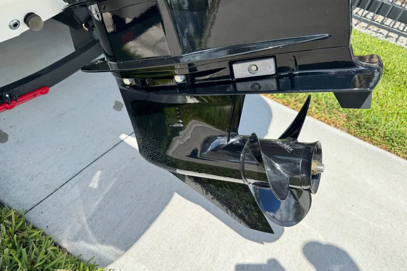 Slide: The Image of 2024 Tahoe 185 S boat propeller on concrete and grass background. - 8