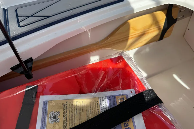 Slide: The Image of 2024 Tahoe 185 S boat interior with paddle and safety equipment. - 85