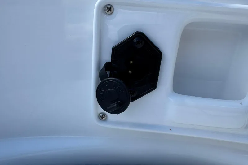 Slide: The Image of 2024 Tahoe 185 S boat power outlet on white surface. - 87