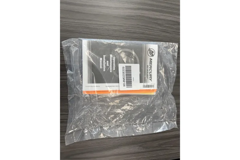 Slide: The Image of Clear plastic bag with Mercury Marine operation manual for Tahoe 185 S, 2024 model. - 90