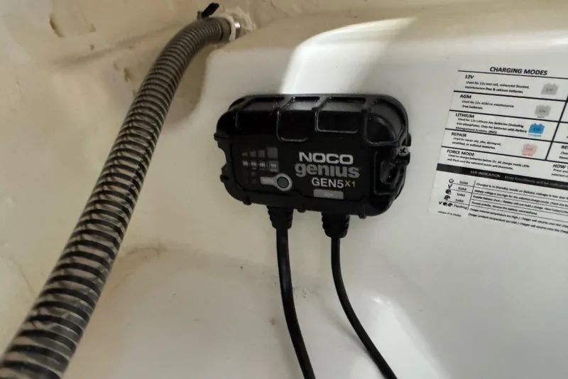 Slide: The Image of NOCO Genius GEN5X1 charger in 2024 Tahoe 185 S boat interior. - 97