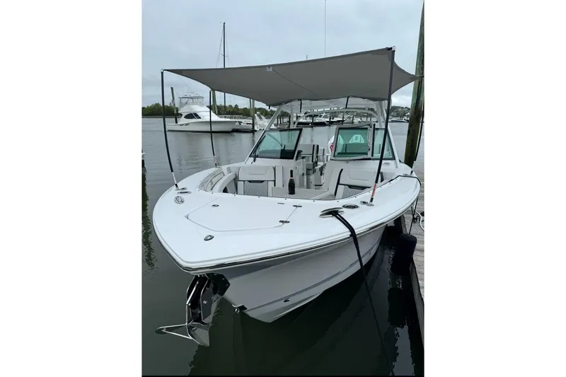 Slide: The Image of 2024 Blackfin 302 DC helm with Garmin navigation and Mercury controls. - 11