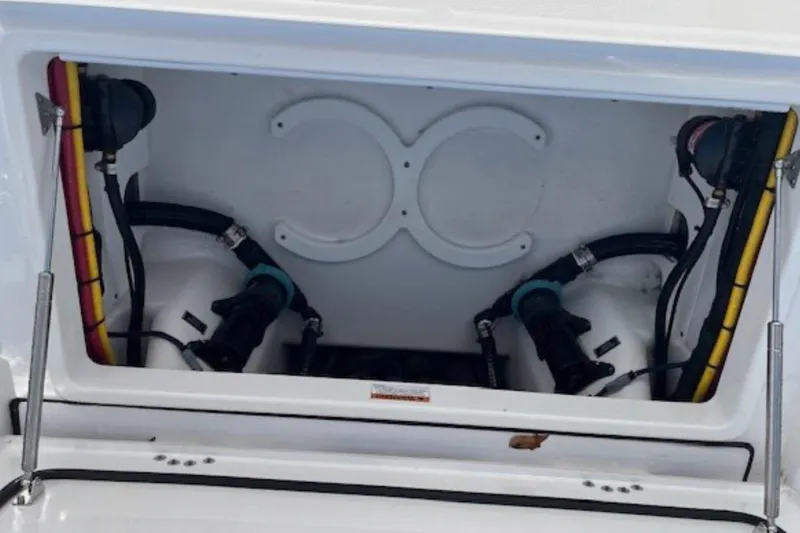 Slide: The Image of 2024 Blackfin 302 DC boat compartment with hoses and fittings. - 22
