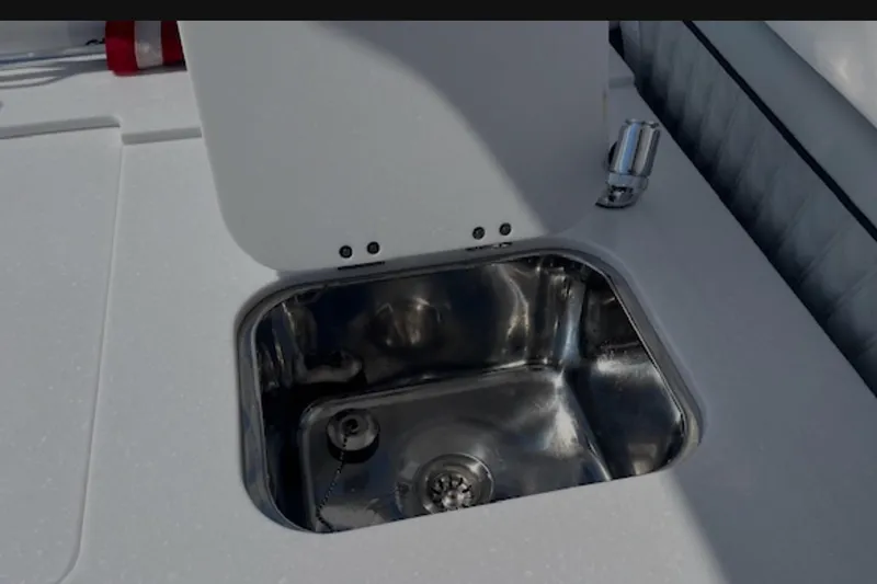 Slide: The Image of Stainless steel sink on 2024 Blackfin 302 DC boat deck. - 26