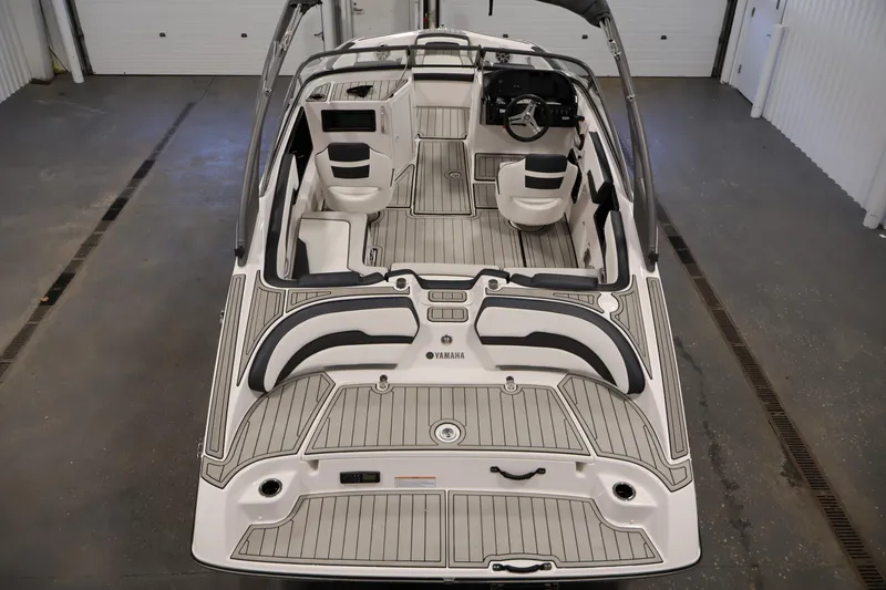 Slide: The Image of 2020 Yamaha Boats 195S interior view, showcasing seating and deck layout. - 10