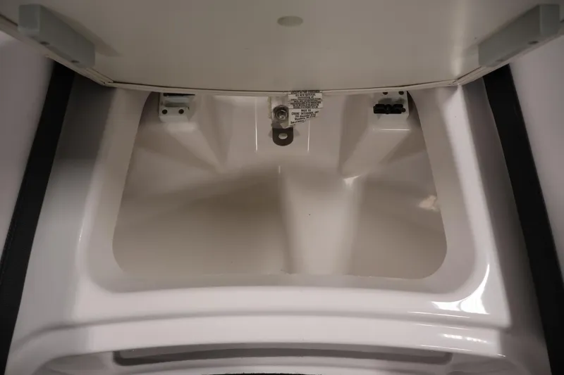 Slide: The Image of Storage compartment of 2020 Yamaha Boats 195S, open and empty. - 12