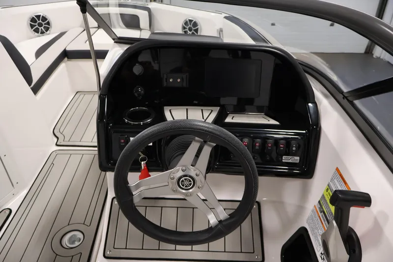Slide: The Image of 2020 Yamaha Boats 195S dashboard with steering wheel and control panel. - 20