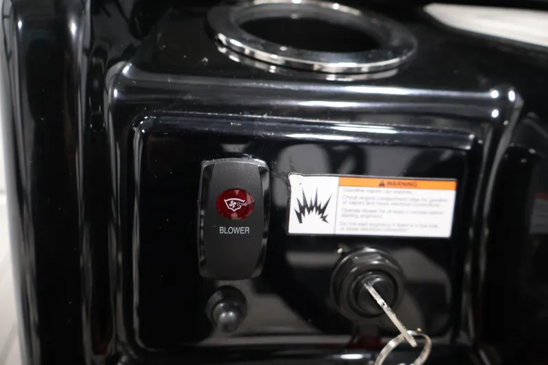 Slide: The Image of Control panel of 2020 Yamaha Boats 195S with blower switch and warning label. - 25