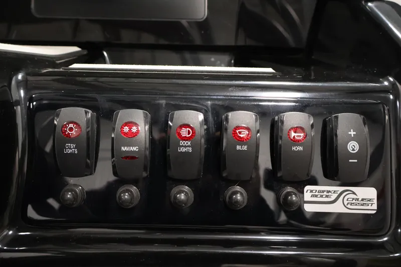 Slide: The Image of Control panel of 2020 Yamaha Boats 195S with various switches and buttons. - 26