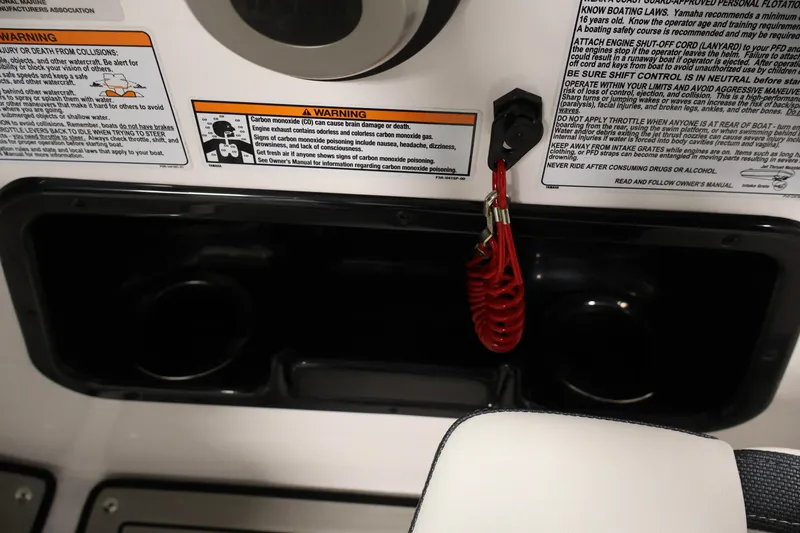 Slide: The Image of 2020 Yamaha Boats 195S dashboard with safety warnings and red engine shut-off cord. - 28