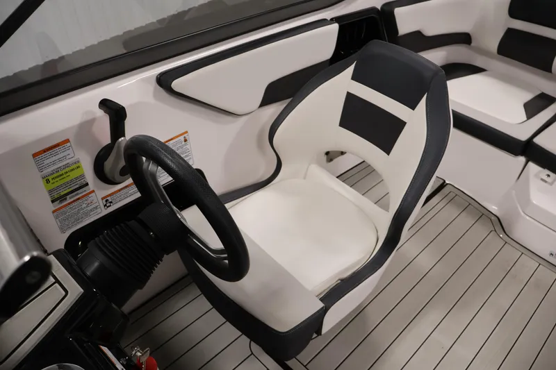 Slide: The Image of 2020 Yamaha Boats 195S interior with steering wheel and seating. - 29
