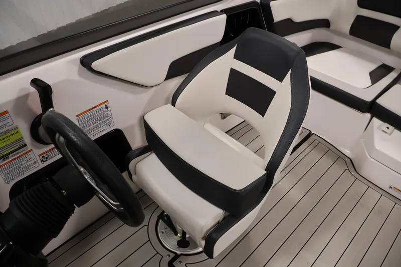 Slide: The Image of 2020 Yamaha Boats 195S interior with steering wheel and cushioned seating. - 30