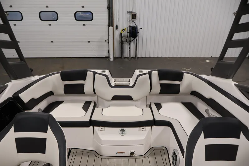 Slide: The Image of 2020 Yamaha Boats 195S interior with sleek black and white seating design. - 36
