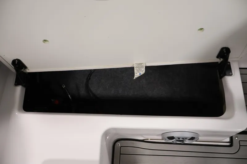 Slide: The Image of Open storage compartment in 2020 Yamaha Boats 195S, showcasing interior space and design. - 37