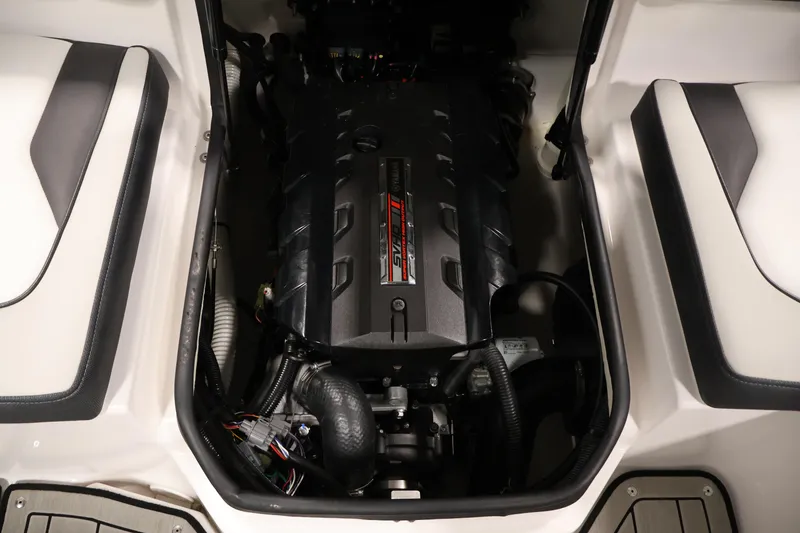 Slide: The Image of Engine compartment of a 2020 Yamaha Boats 195S, showcasing the powerful motor. - 38