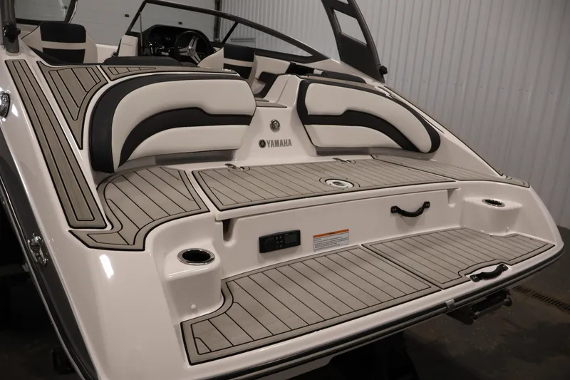 Slide: The Image of 2020 Yamaha Boats 195S rear view with sleek seating and deck design. - 45